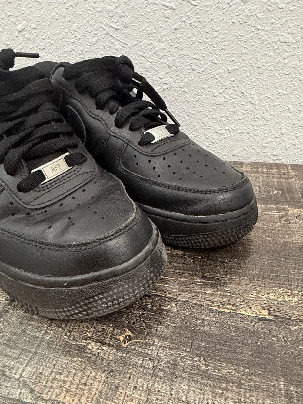 Nike Men's All-Black Leather Low-Top Sneakers